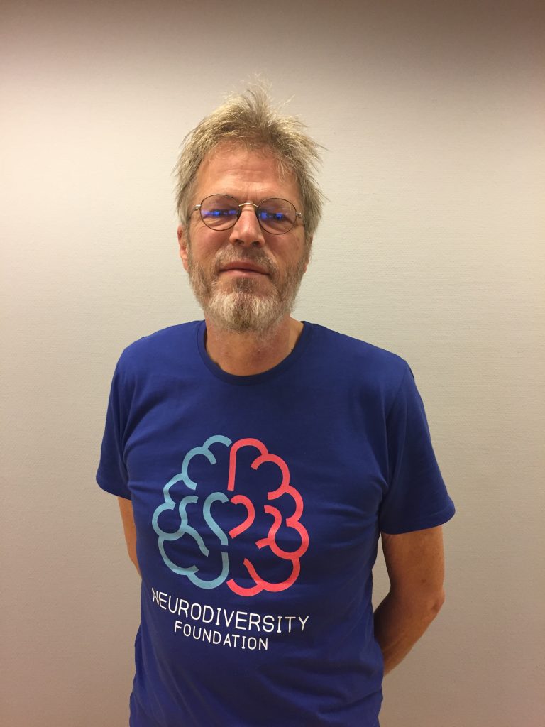 wearing the first version of the Neurodiversity Foundation t-shirt